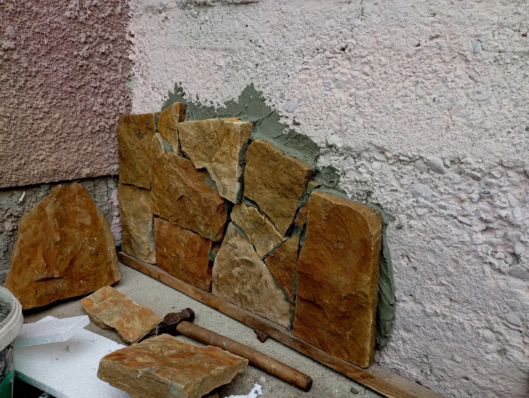 Expertly built stone wall by Academy Masonry in Suffolk County, Massachusetts, showcasing handcrafted natural stone, precise stacking, and durable construction for residential or commercial landscaping projects.